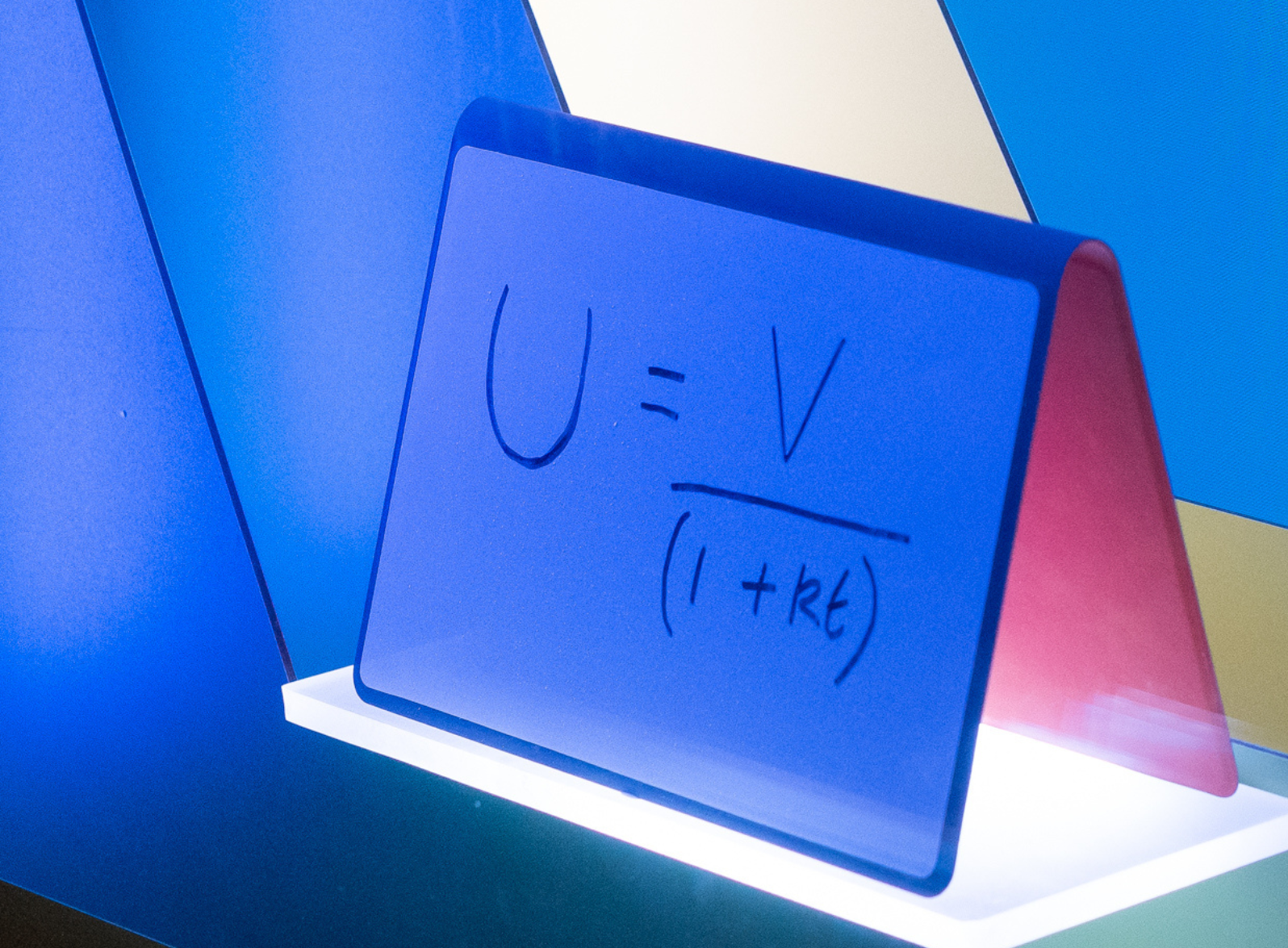 Photo of an equation written on a whiteboard in the window display