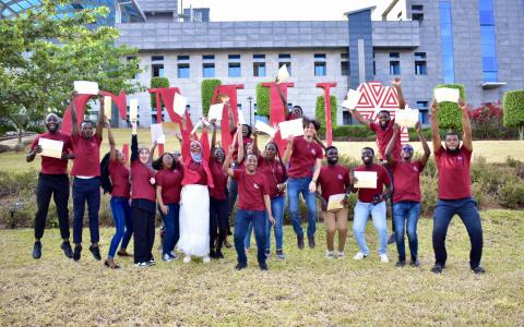 CaMinA students jump for joy with their certificates in hand